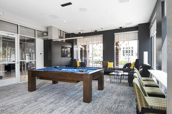 Clubhouse with sitting areas, tv, kitchen, and billiard table